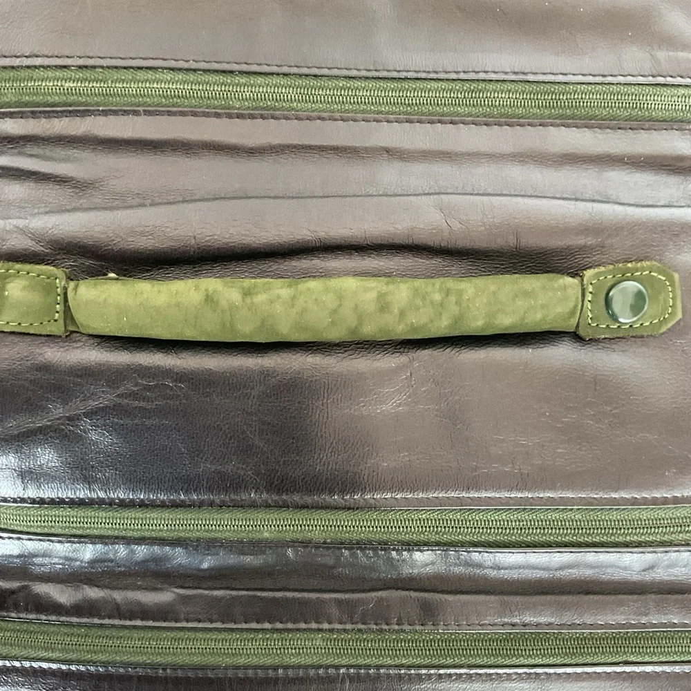 Saks Fifth Avenue vintage green suede leather jewelry roll.